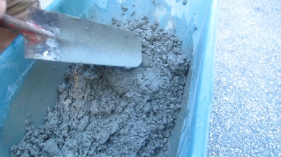 shovel mixing concrete