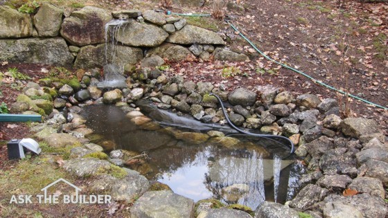  This garden pond was built with a simple shovel and some sweat. A large piece of rubber roofing and rocks are all that's needed.  Photo Credit: Tim Carter