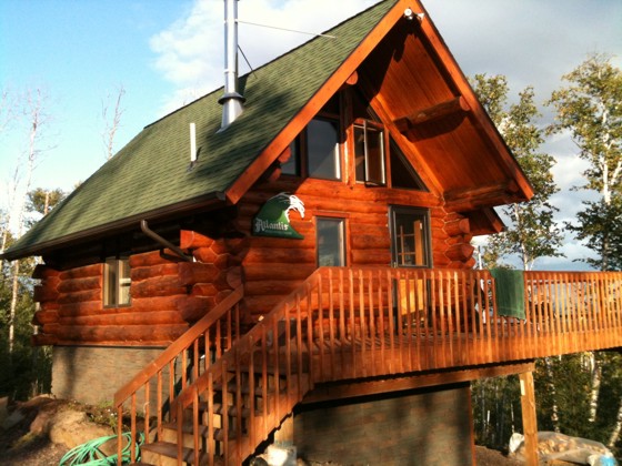 Here's a small log cabin that looks big because of the roof pitch and generous overhangs. Photo Credit: Scott Brown