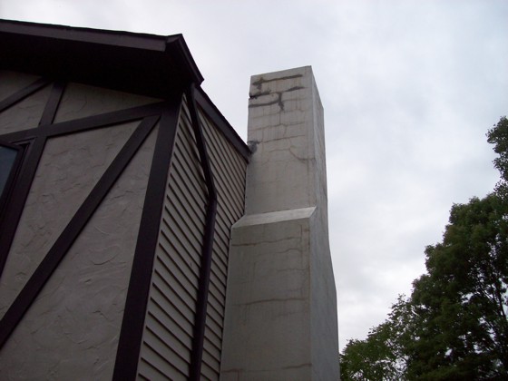 This chimney has some cosmetic cracking and an inferior crown. It can be repaired properly and will last for decades if done right. Photo Credit: John Loughran
