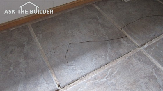 This ceramic floor tile has a big crack in it and is dangerous for those with bare feet. Photo credit: Tim Carter
