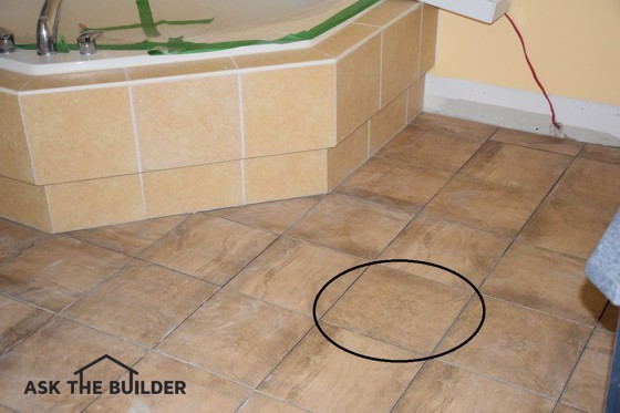 Many of the floor tiles in this photo don’t match the circled one. The homeowner thought they’d all match. Photo Credit: Sandy Mayor
