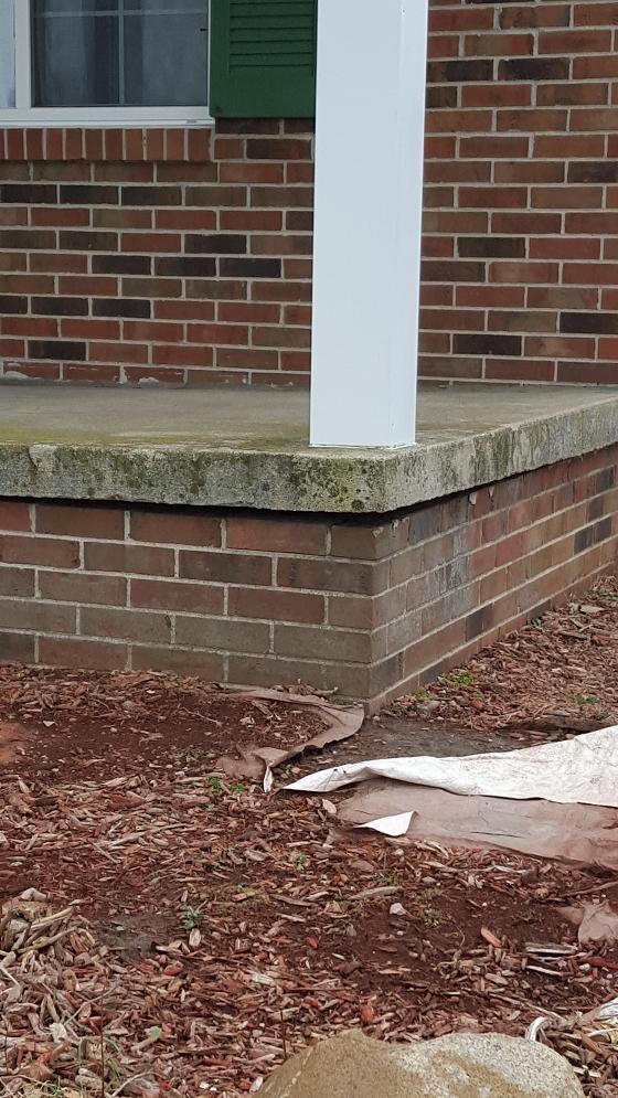 You have to look very closely at this photo for the clue as to what’s happening with this porch slab. Photo Credit: Sami Boraby