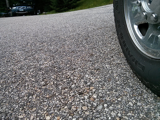 This blacktop driveway is twenty years old and has never been sealed. It’s in very good condition. Photo credit: Tim Carter