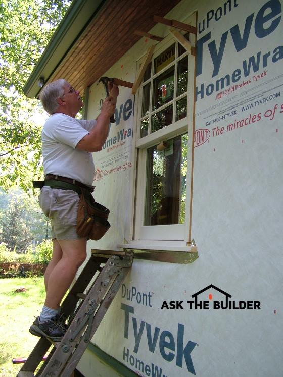 590 tim installing window on ladder