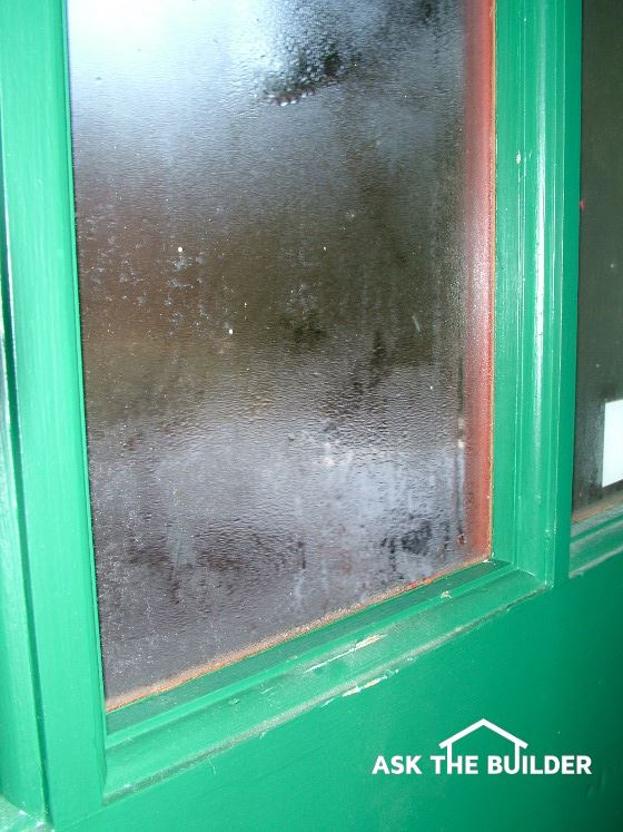 condensation causes green framed wet window