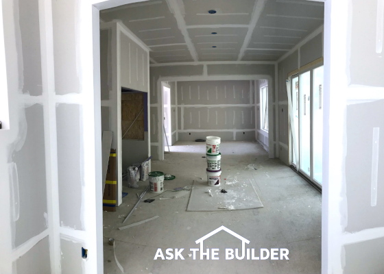 drywall being finished new home