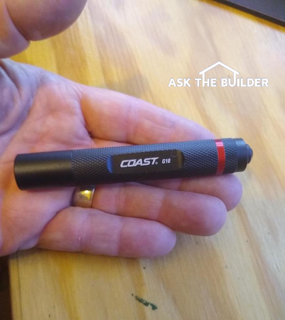 Coast G10 LED Flashlight in hand