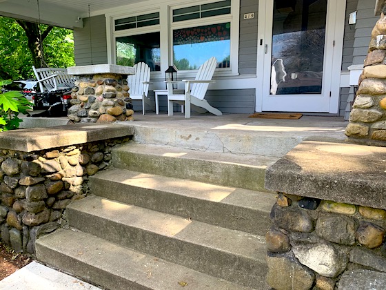 concrete front porch with steps