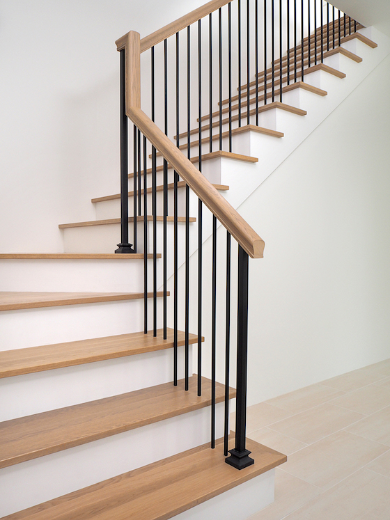 wood staircase with iron balusters new house