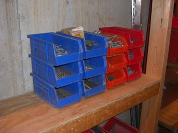 blue and red akro plastic parts bins